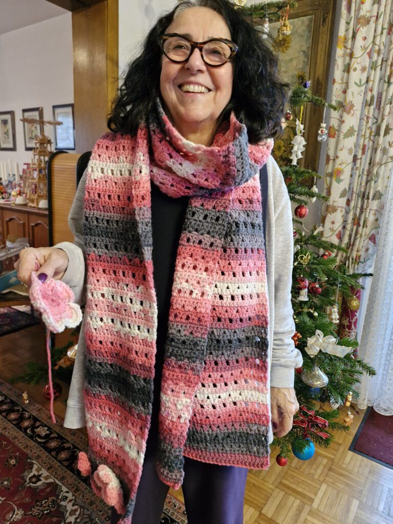 Batik Flower Shawl crochet pattern worn as a chunky scarf